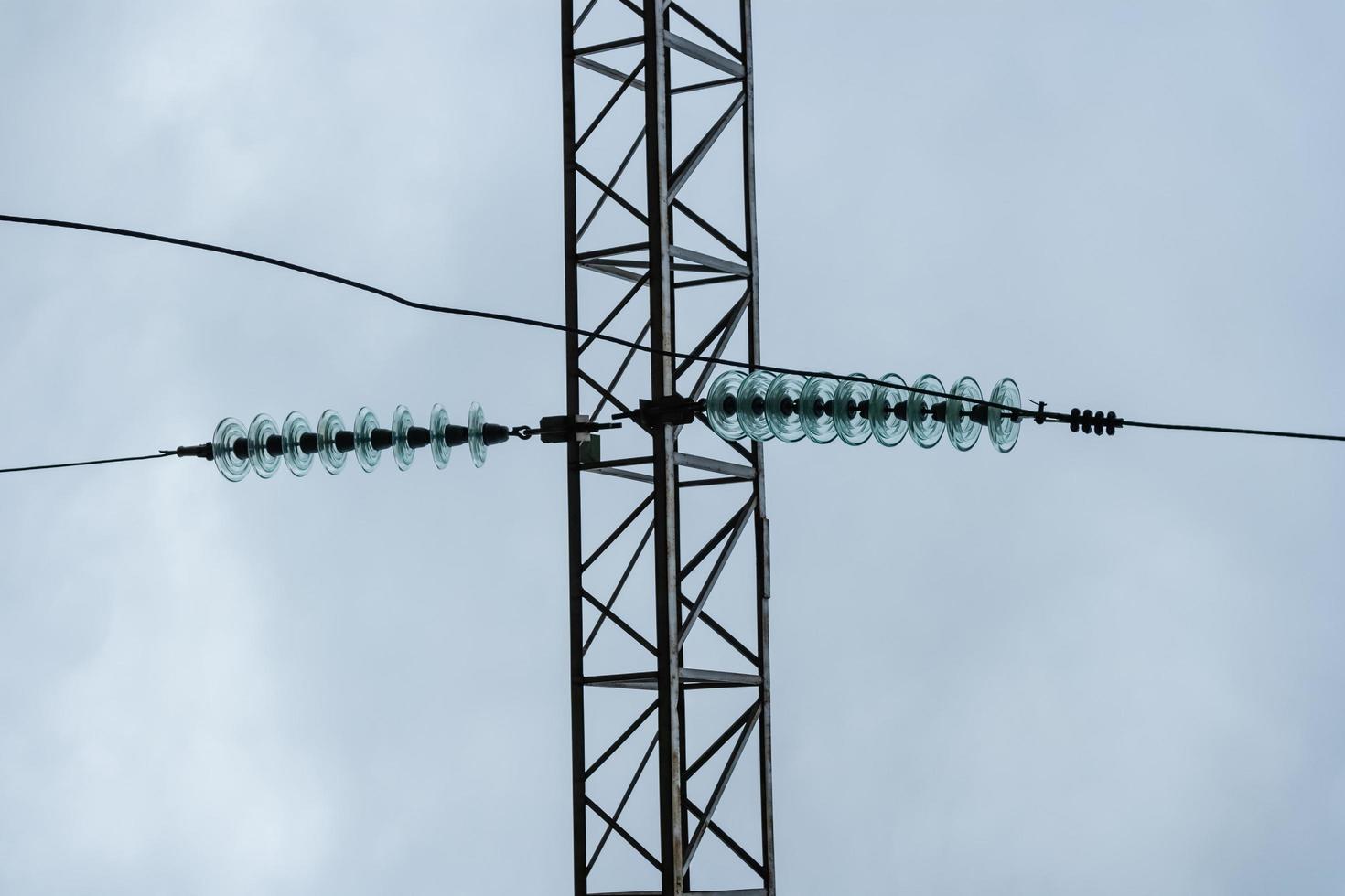 High-voltage line glass insulators at an electrical substation. photo