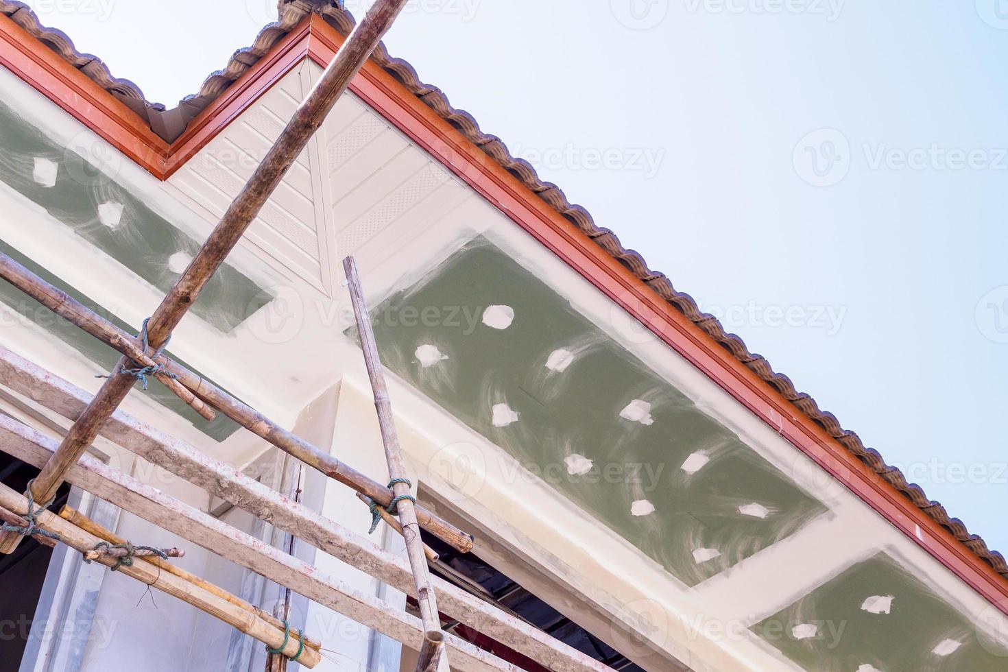 Soffit and Fascia Board Installation at House Building Construction Site photo