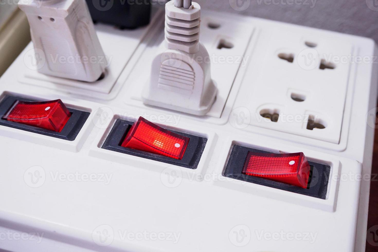 Multiple socket with connected plugs photo