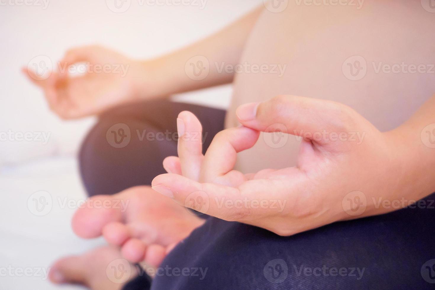 pregnant woman doing yoga photo