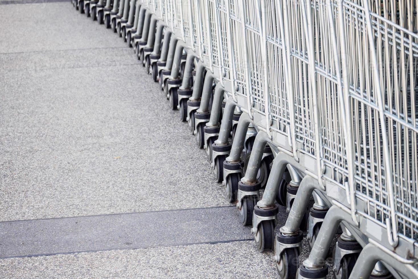 Shopping carts on parking lot photo