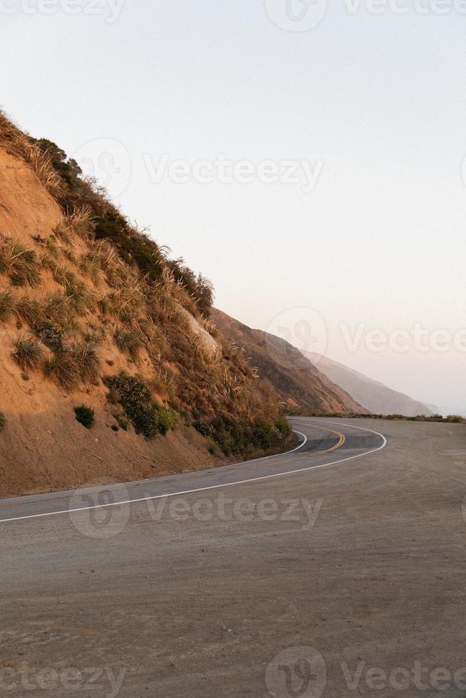 Road and hillside 8909682 Stock Photo at Vecteezy