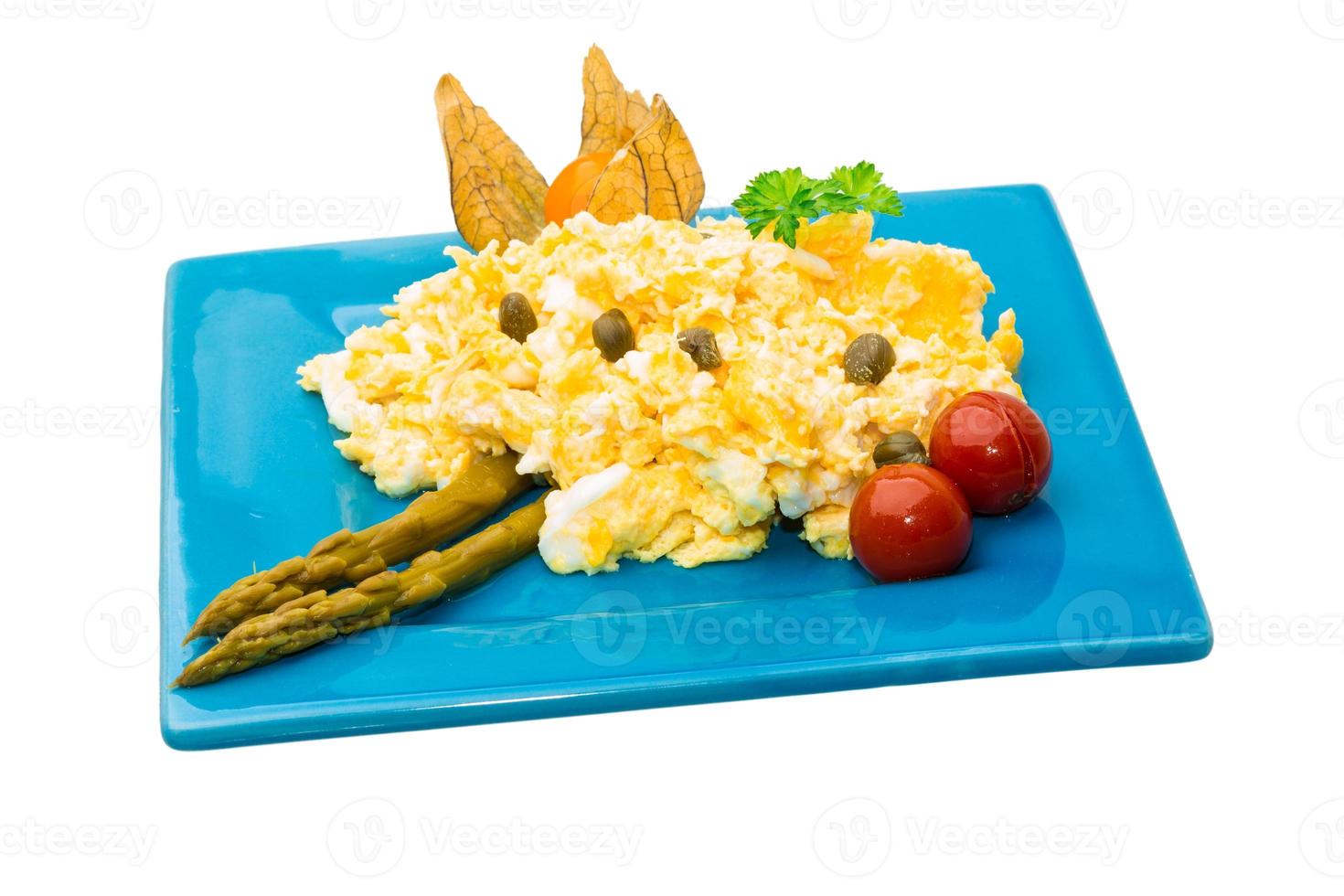 Scrambled eggs on white background photo