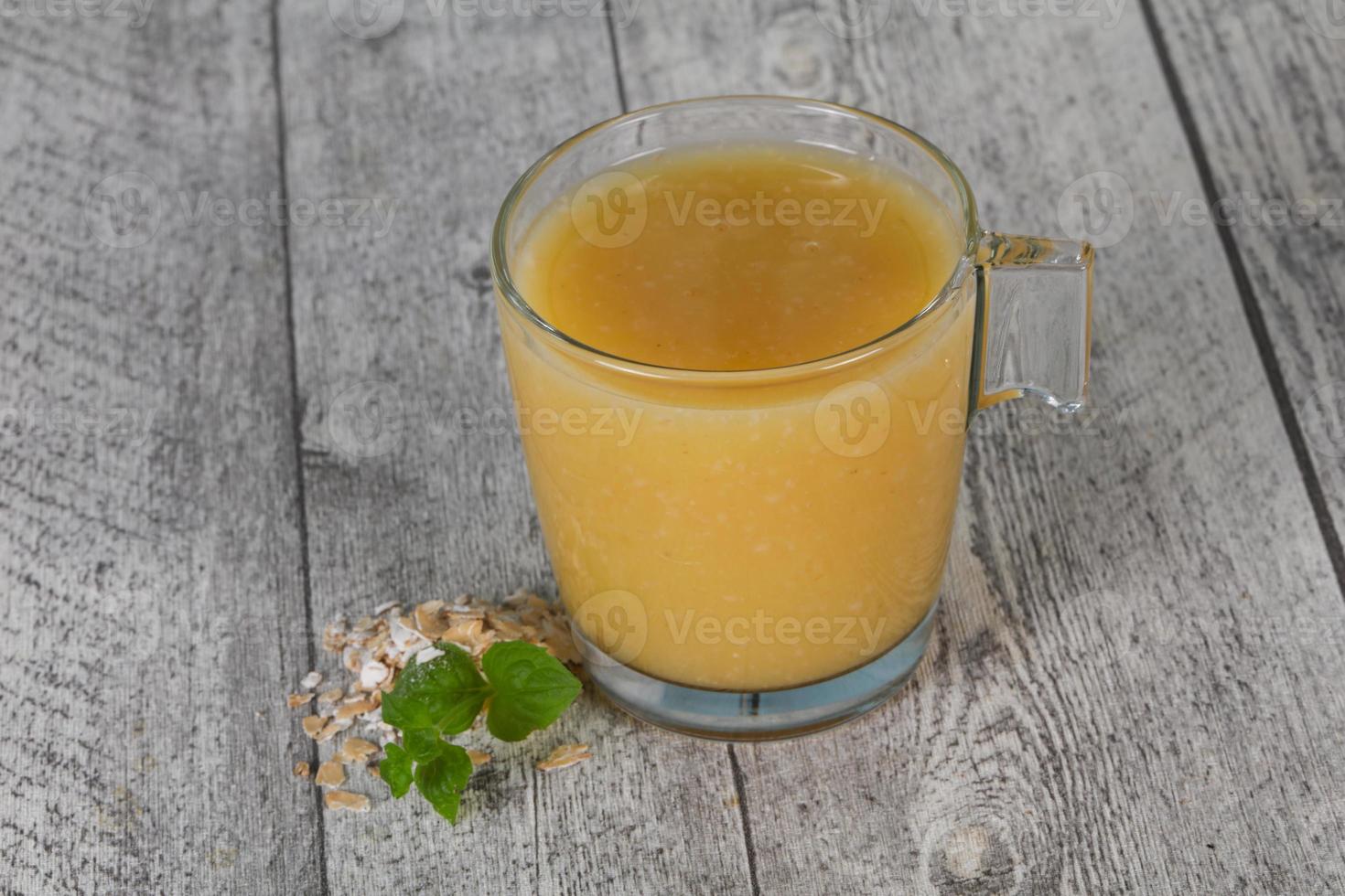 Dietary vegetarian oats milk over wooden photo