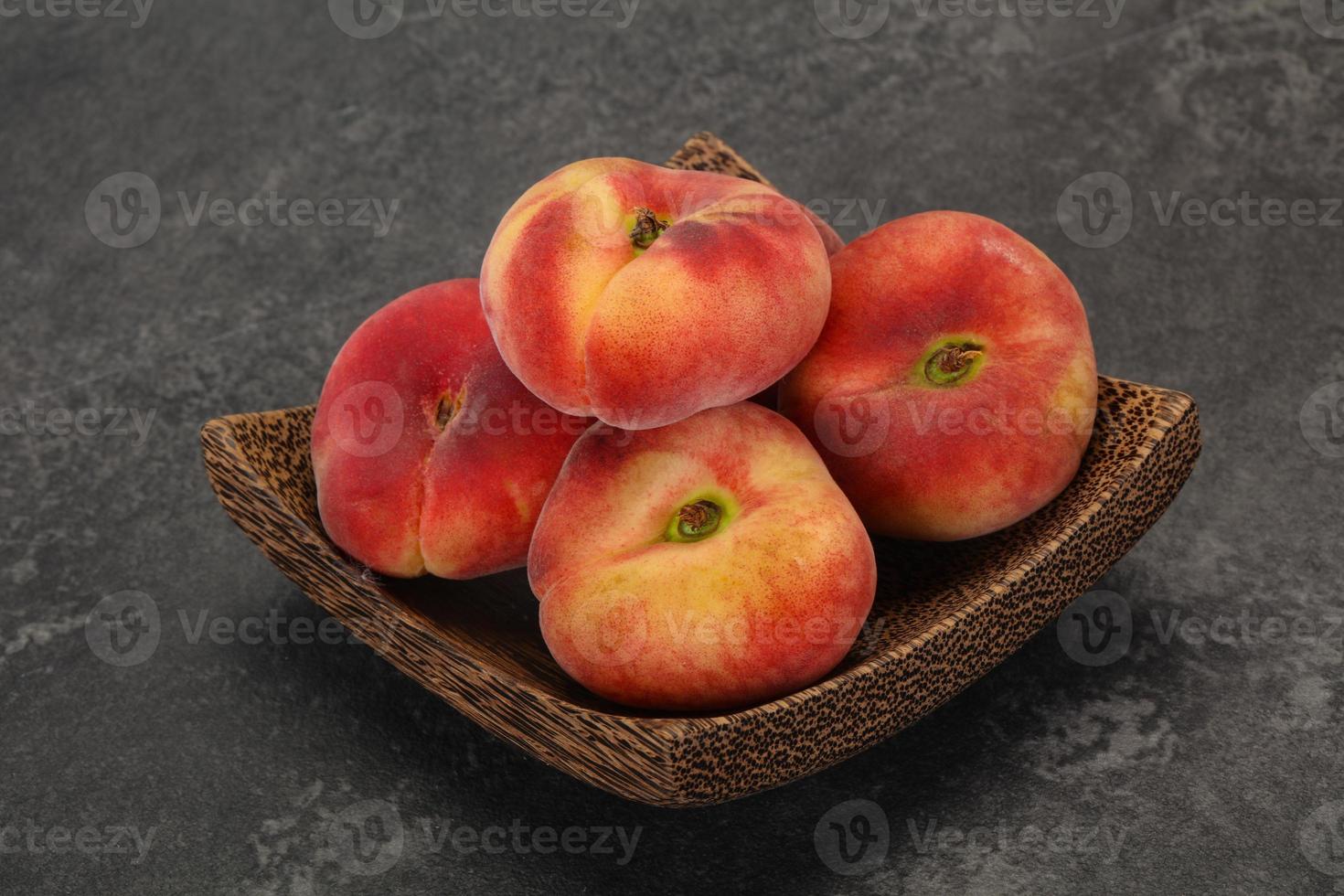 Sweet ripe tasty flat peach photo