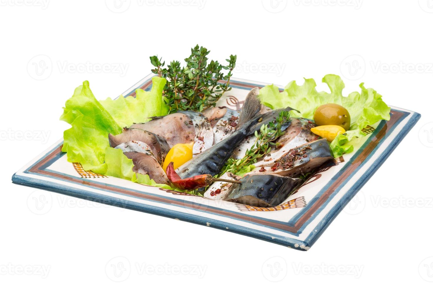 Mackerels on the plate and white background photo