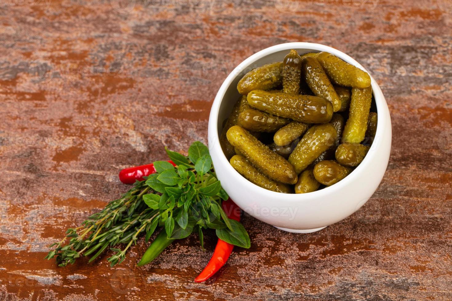 Pickled small cucumbers photo