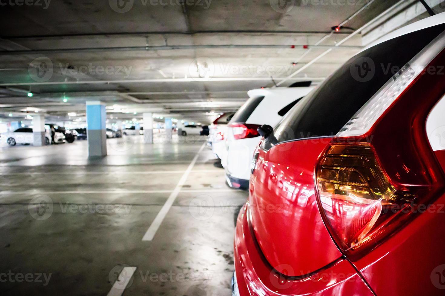 cars in parking garage interior photo
