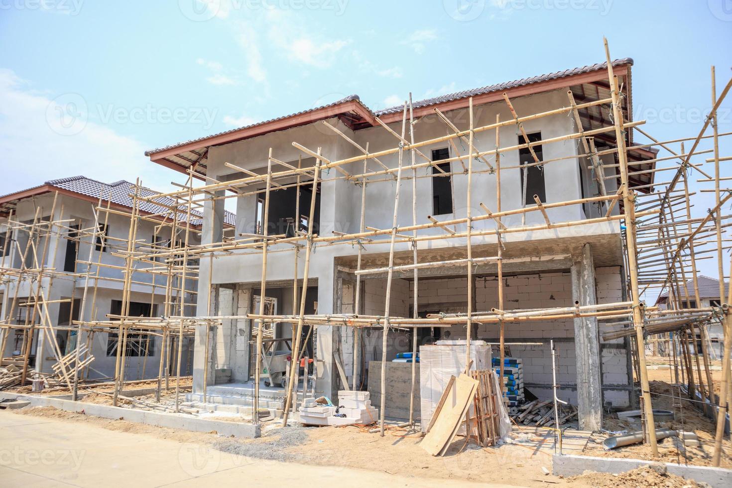 house under construction with autoclaved aerated concrete block structure at building site photo