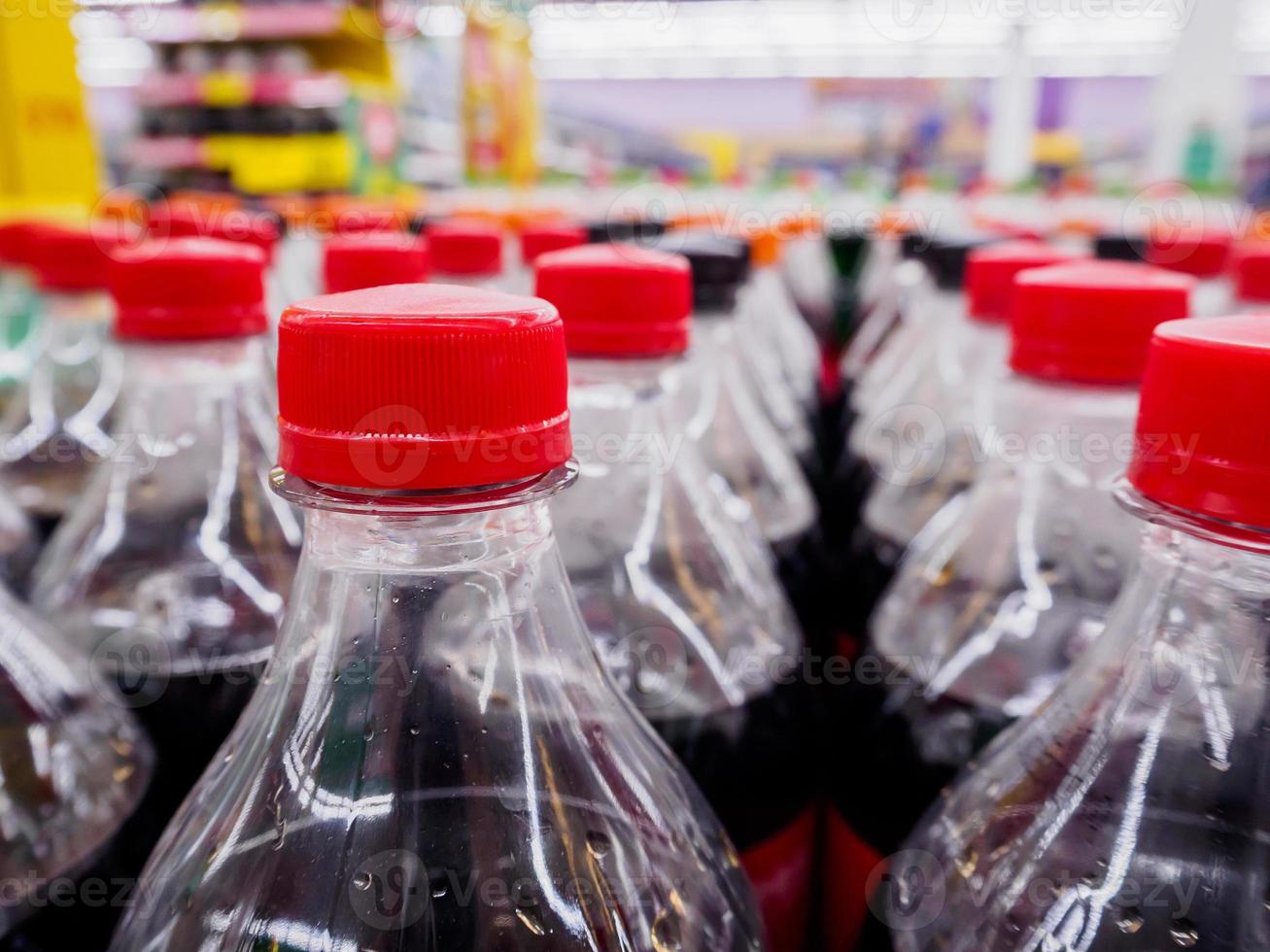 Carbonated soft drink bottles close up photo