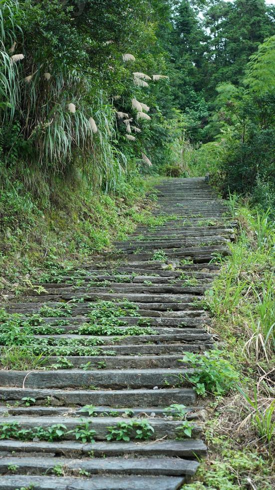 One old climbing countryroad view made by the stone stairs in the countryside of the China photo