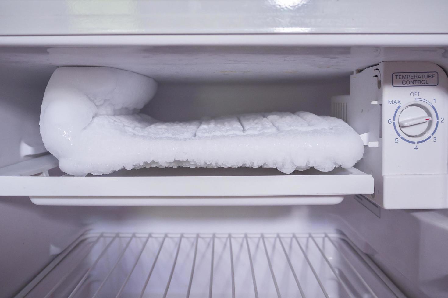 frozen Ice buildup in the freezer of refrigerator photo