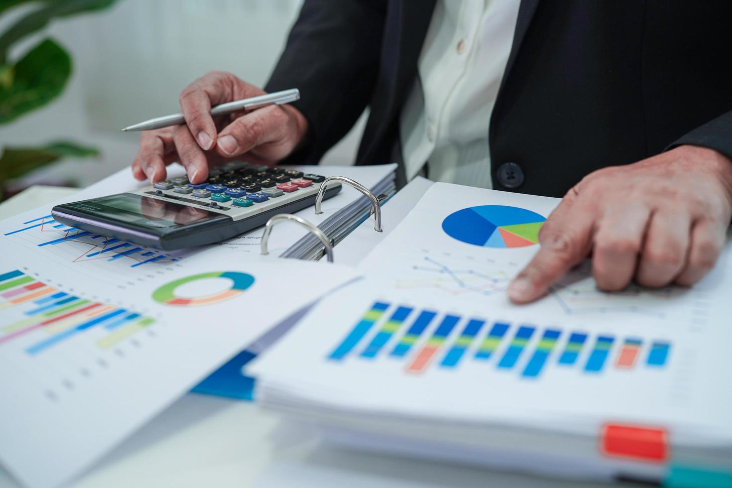 Businessman working and analysis with statistic graph in office. photo