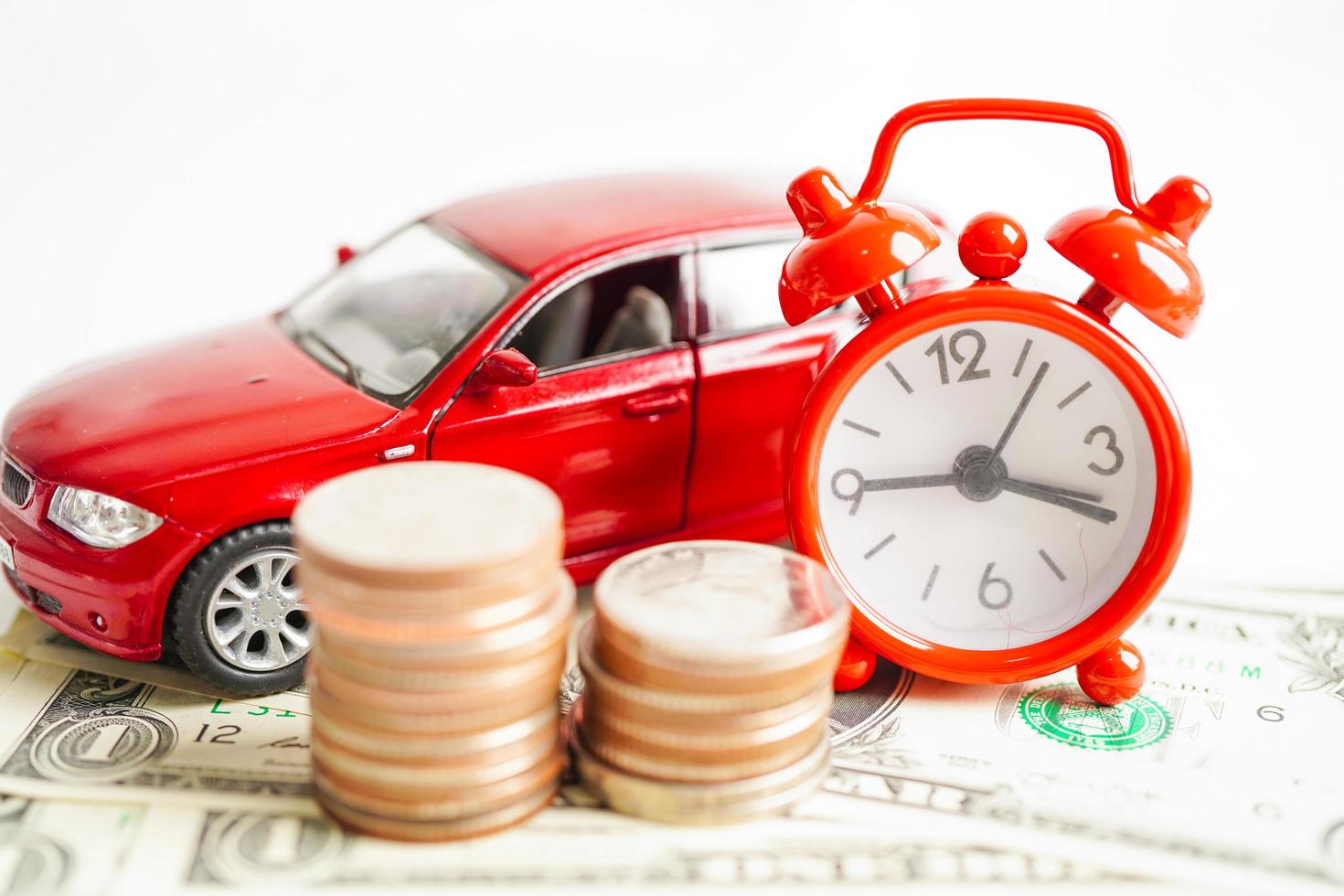 Car on coins money, saving bank, finance, installment payment, car loan interest. photo