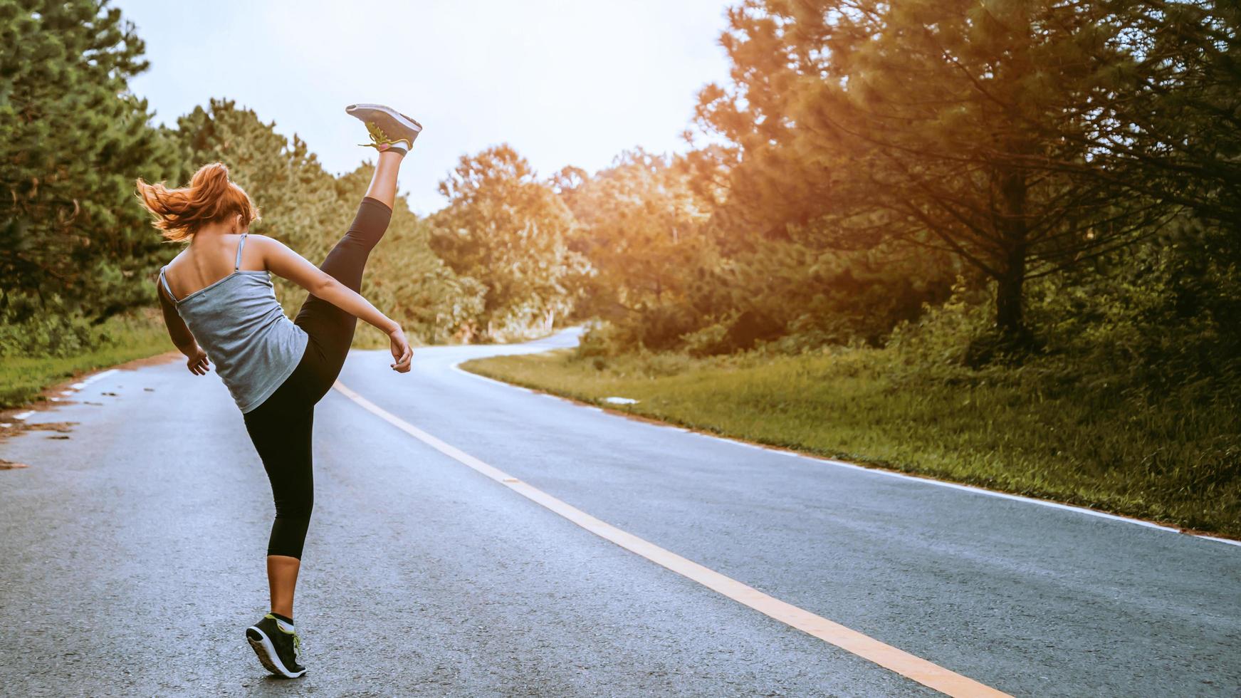 Women exercise on the street. Nature park. Asian women photo