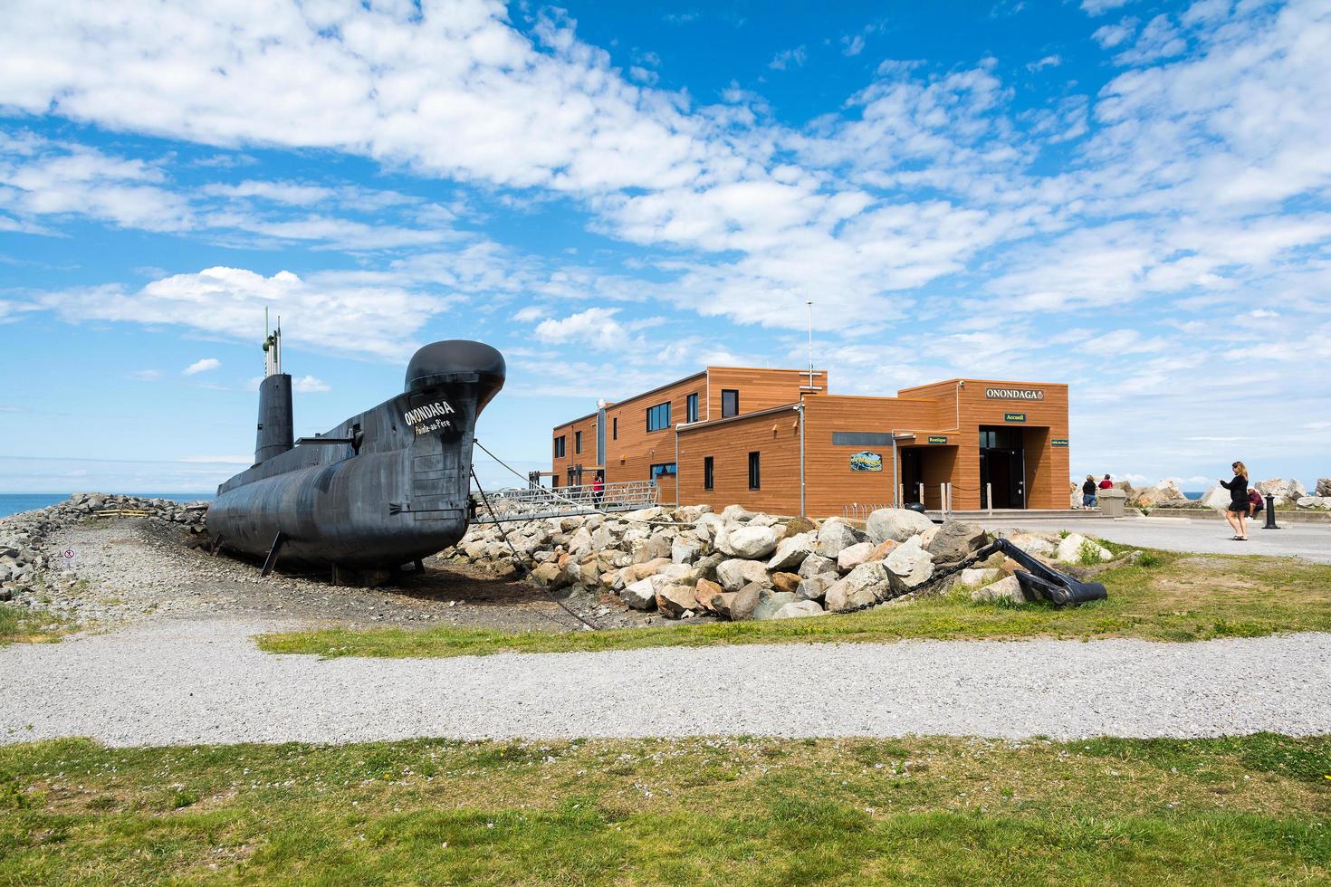 Rimouski, Canada - August 9, 2015 View of the Pointe au Pere lighthouse in the Gaspesie peninsula during a sunny day. photo