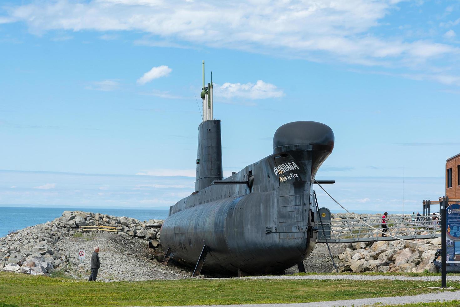 Rimouski, Canada - August 9, 2015 View of the Pointe au Pere lighthouse in the Gaspesie peninsula during a sunny day. photo