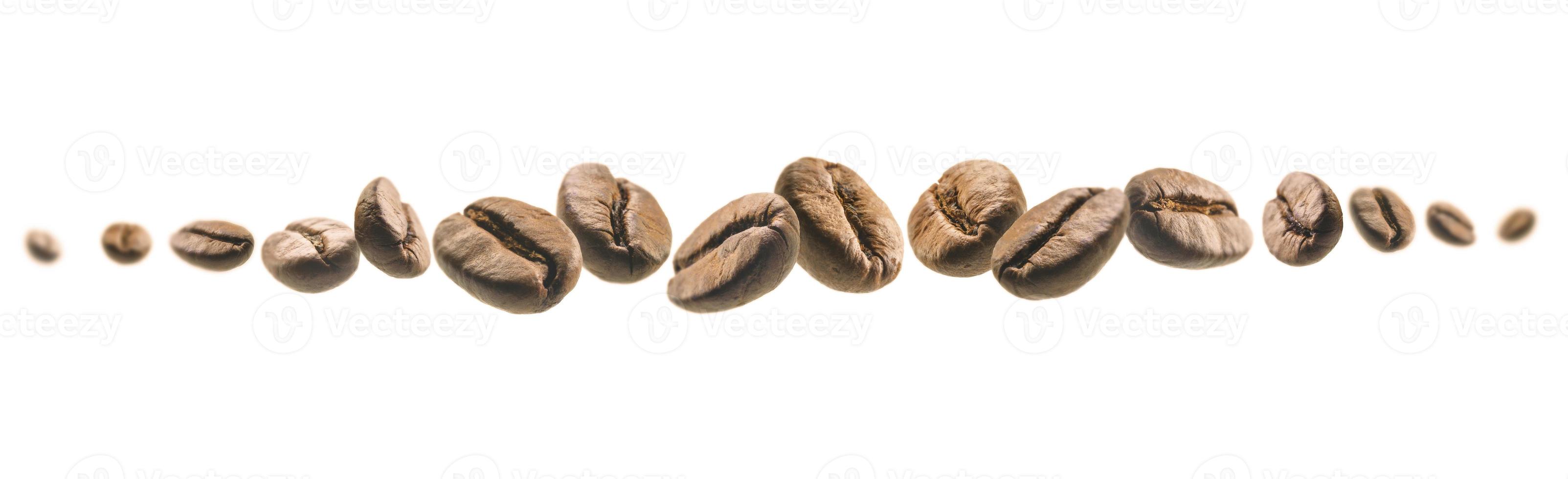 Coffee beans levitate on a white background photo