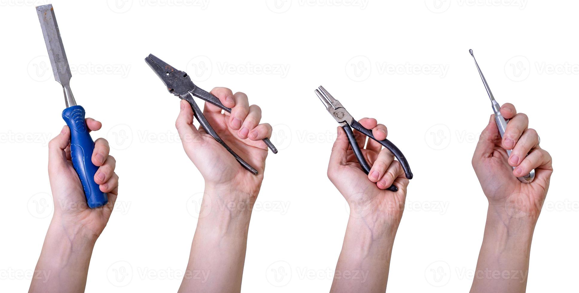 Hands holding hand tools, insulated on white background. photo