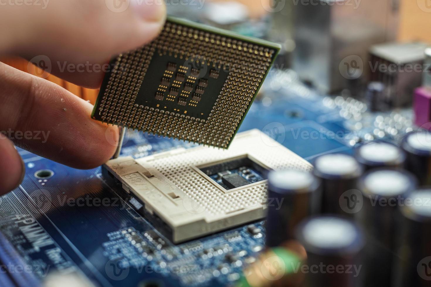 Hand assembled to inspect the electronic circuit board. photo
