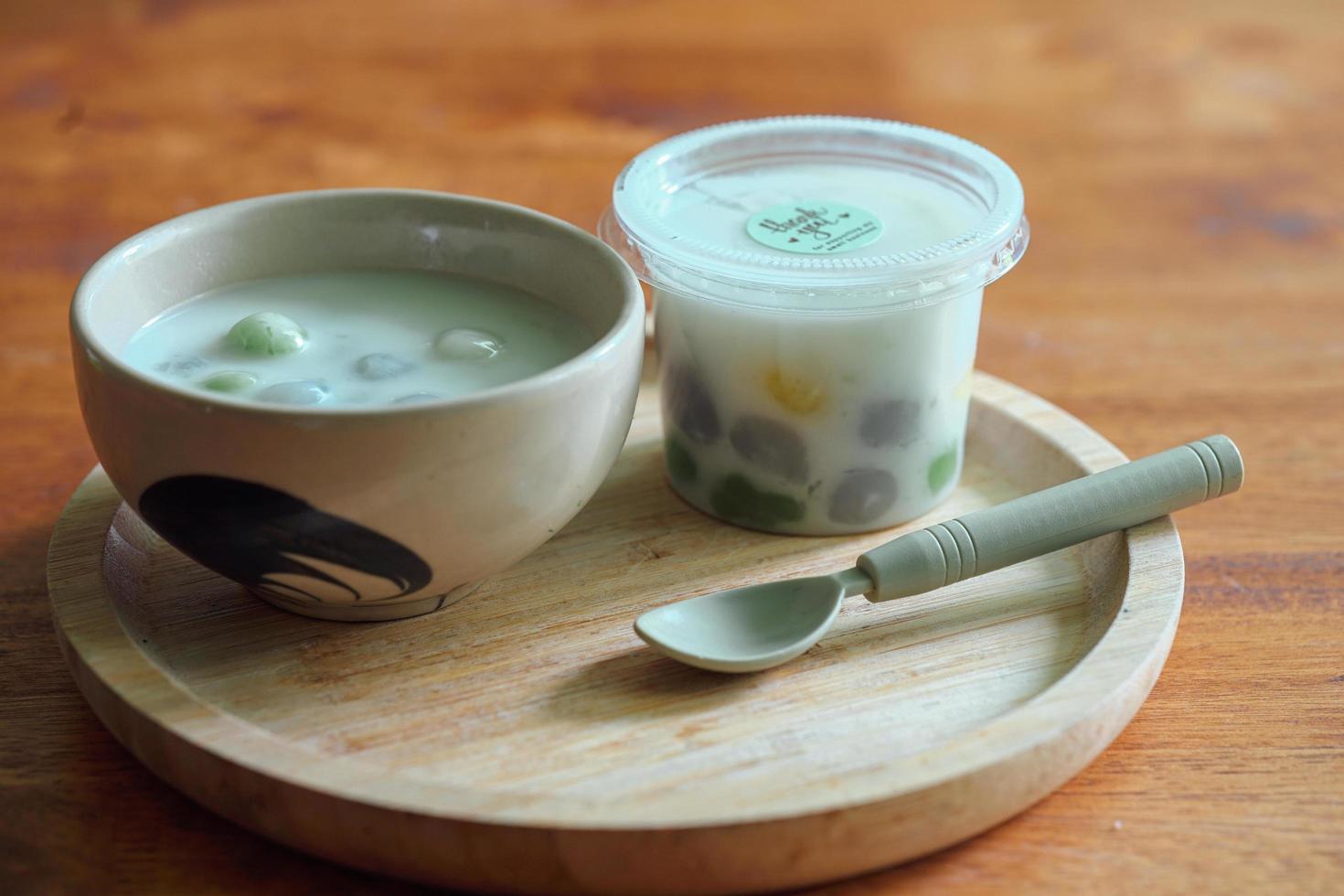 Thai sweetmeat with colorful ball flour. Thai glutinous rice balls in creamy coconut milk syrup. Famous Thai dessert Bualoy photo