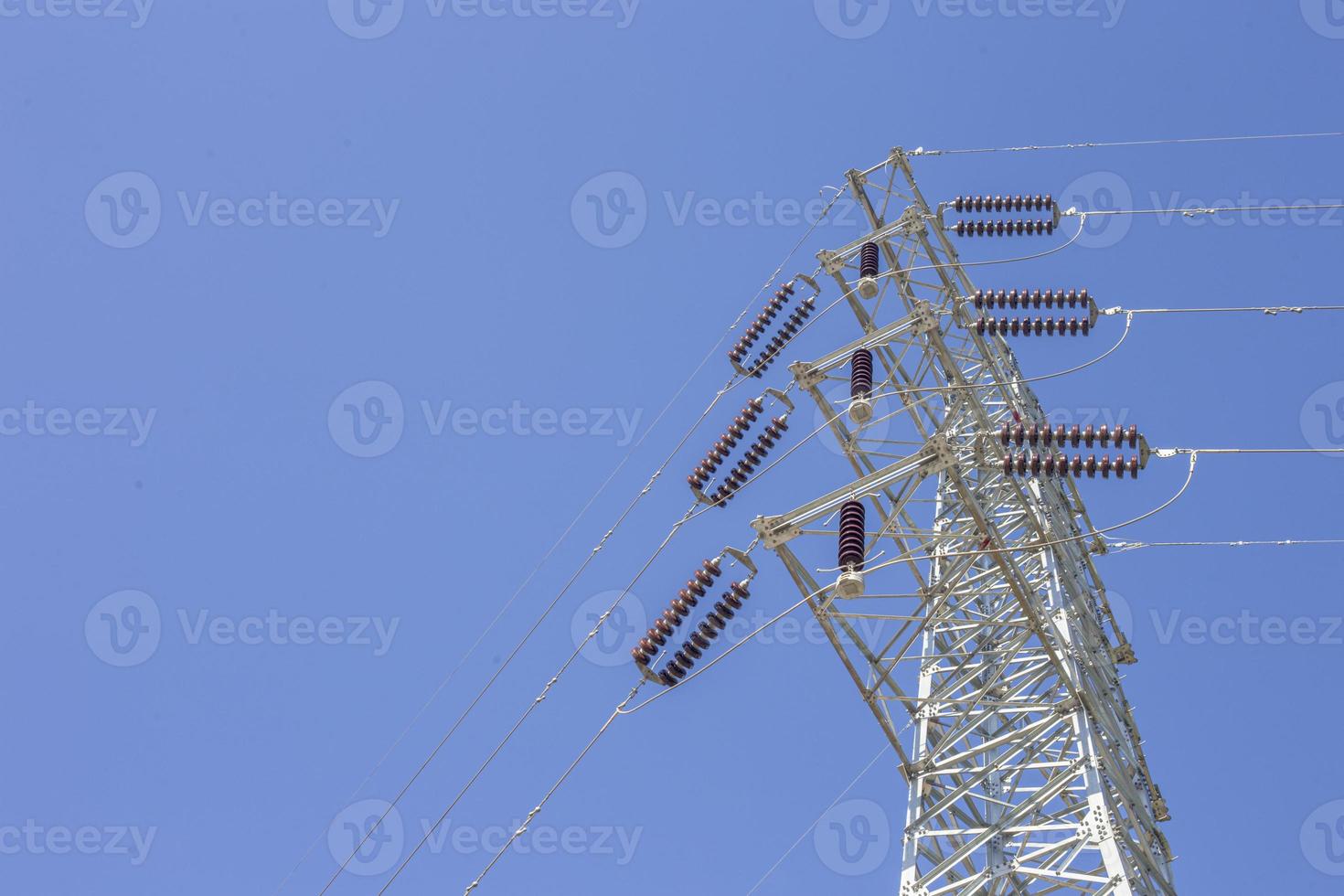 High voltage poles and blue sky photo