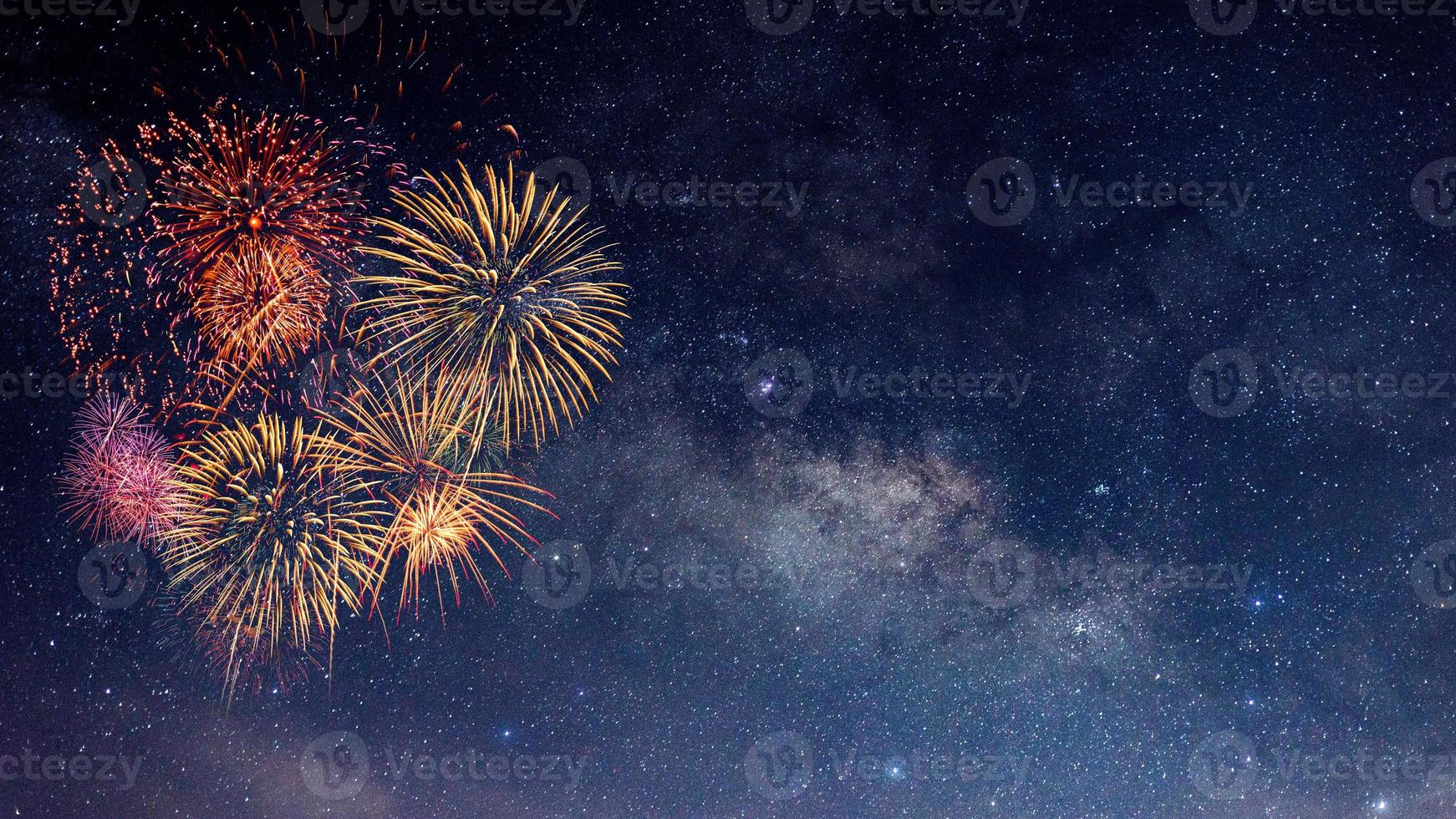 Fireworks with blur milky way background photo