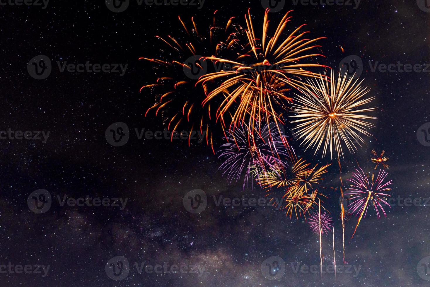 Fireworks with blur milky way background photo