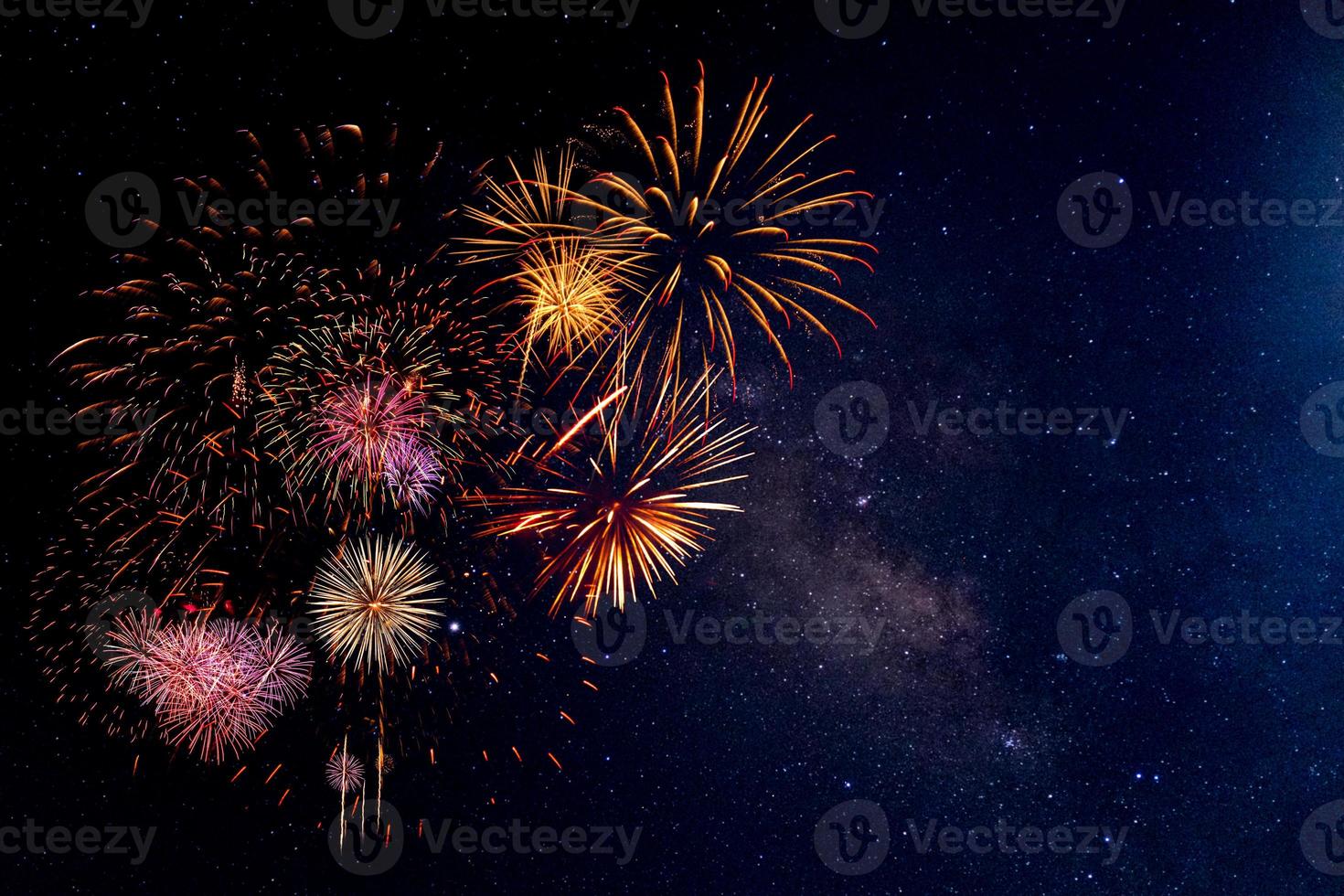 Fireworks with blur milky way background photo