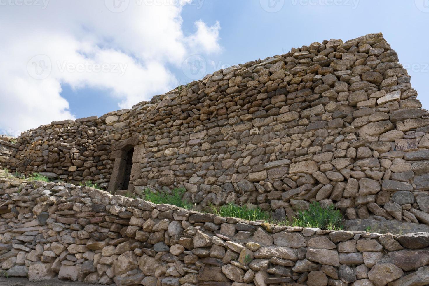 Ancient buildings in Cappadocia above the underground city. The building is made of masonry. photo