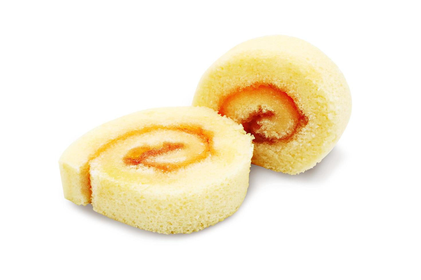 Orange cake roll cream isolated on white background with clipping path. photo