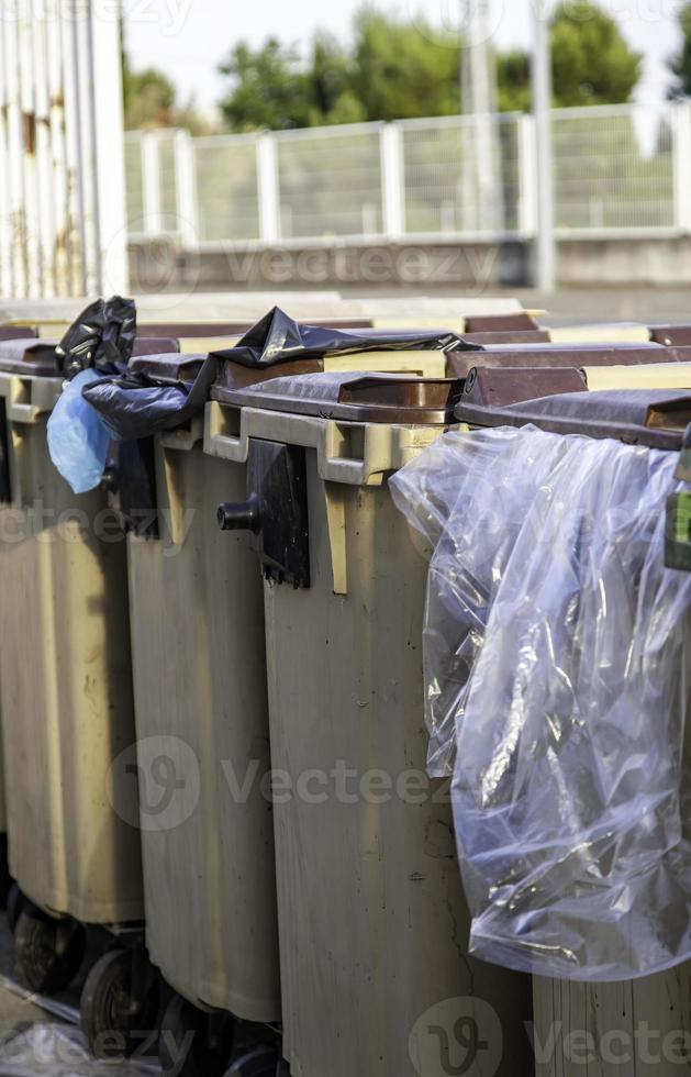 Containers with garbage bags photo