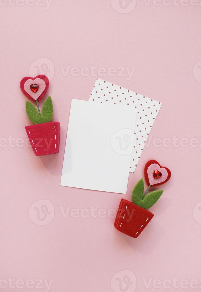 Happy Valentines Day composition. Blank greeting card mockup on pink background photo