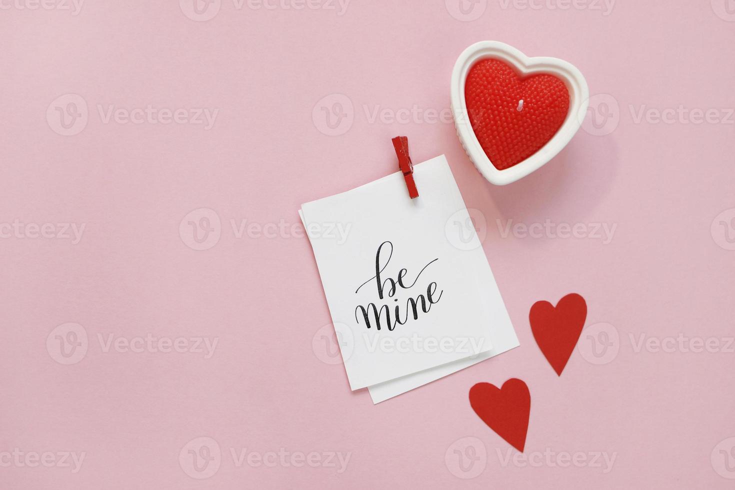 Happy Valentines Day composition. Blank greeting card mockup, red hearts, confetti on pink background photo