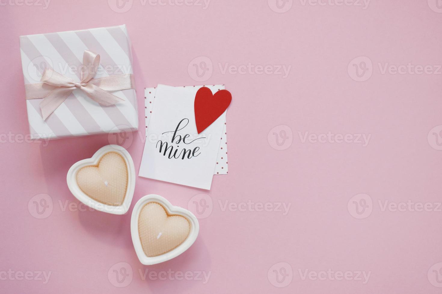 Happy Valentines Day composition. Blank greeting card mockup on pink background photo