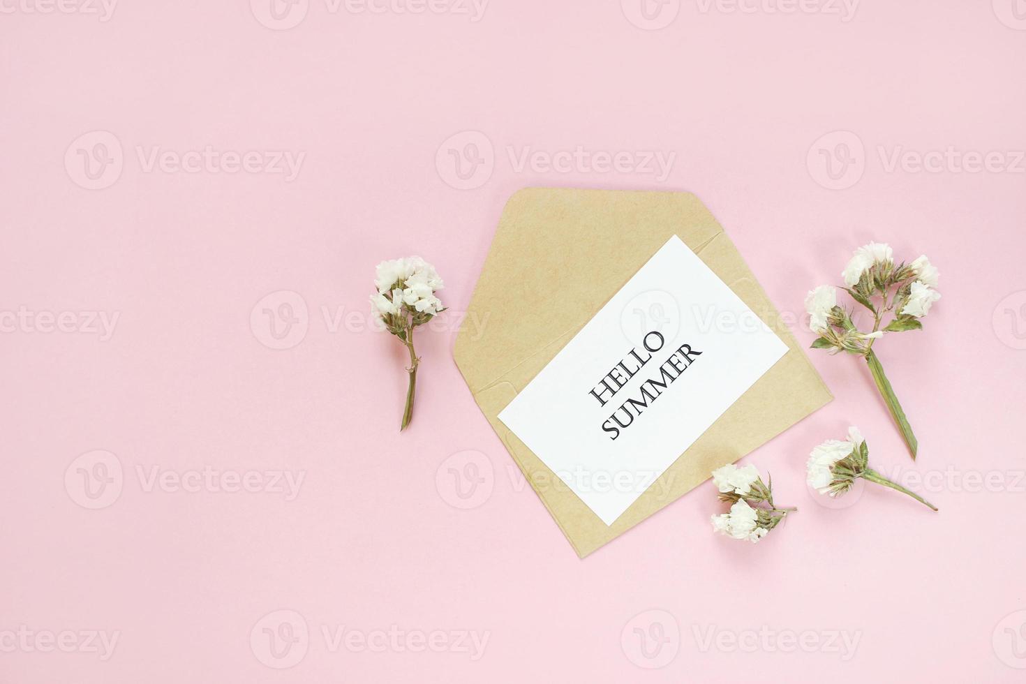 Hello summer. letters Summer and flowers on pink background. Empty card with copy space. photo