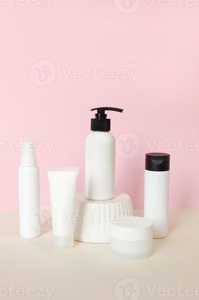 Cosmetics brand mockup on podium pedestal showcase. Beauty cosmetic cream lotion stand background. Selective focus. mock up. White packaging creme bottle photo