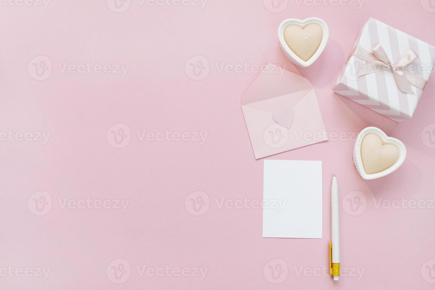 Happy Valentines Day composition. Blank greeting card mockup, gift boxes, hearts, confetti on pink background photo