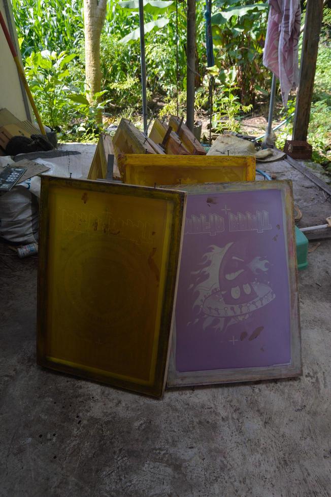 Gresik, indonesia, 2022 - selective focus on manual screen printing wood behind the house photo