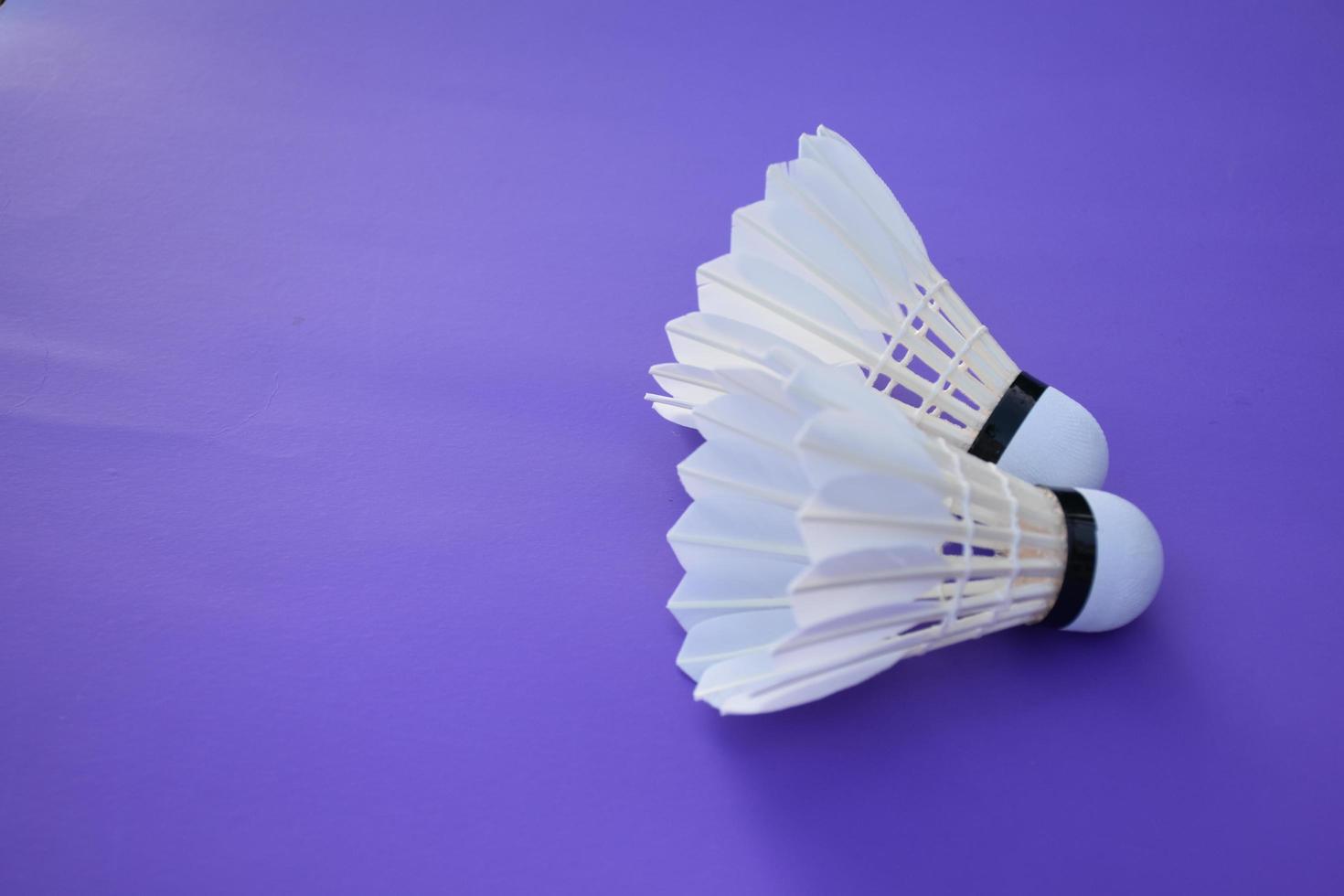 isolated white cream badminton shuttlecock feather, for badminton sport playing. photo