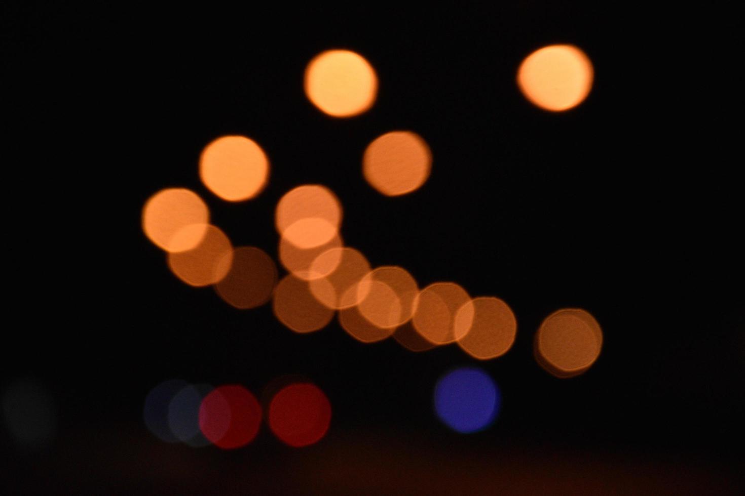 Bokeh street light at night time in urban city of thailand. photo