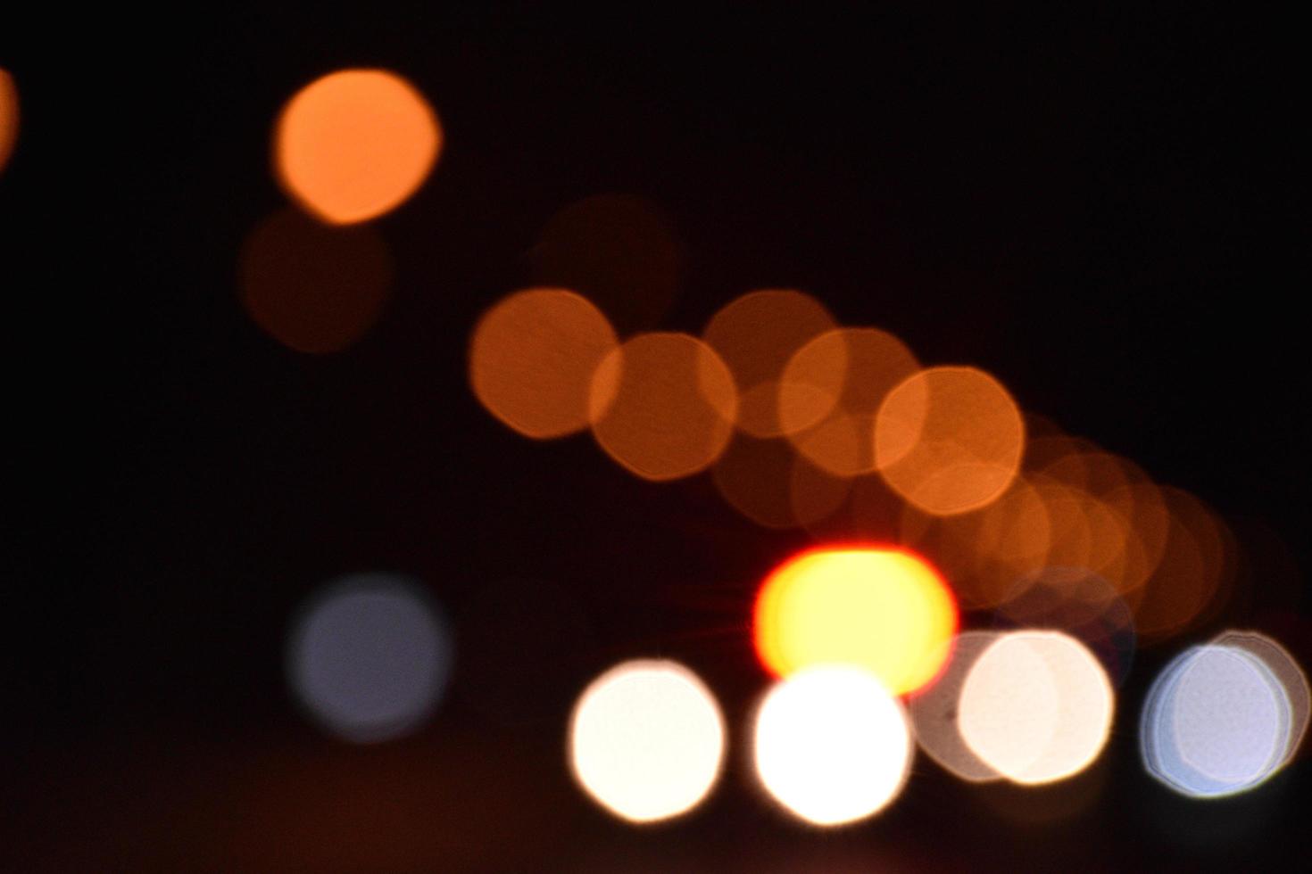 Bokeh street light at night time in urban city of thailand. photo