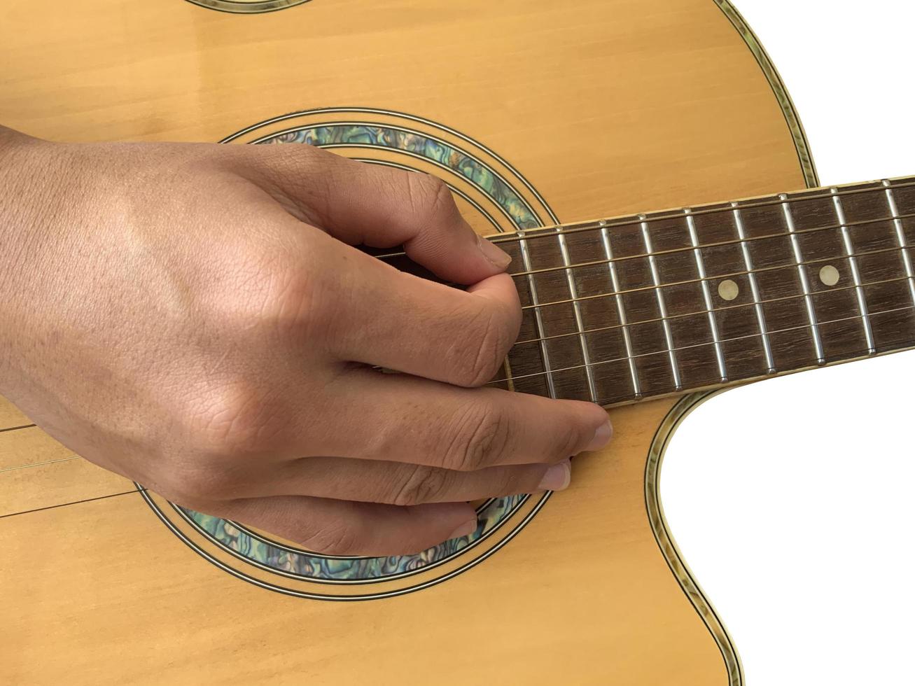 Isolated fingers and hand which is playing the guitar with clipping paths. photo