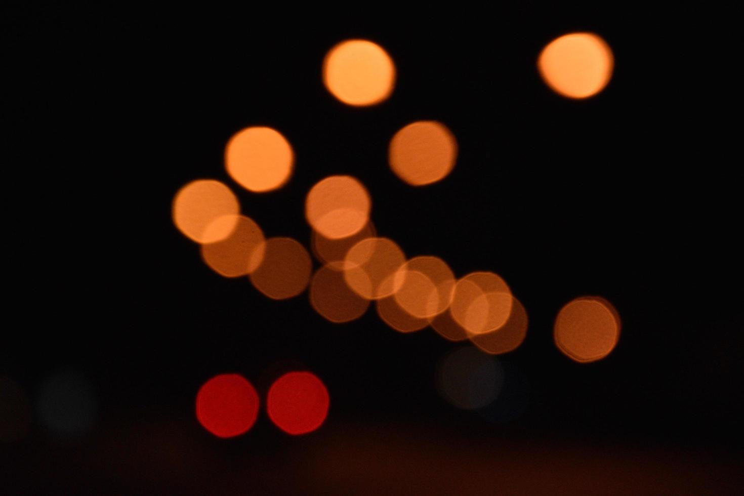 Bokeh street light at night time in urban city of thailand. photo