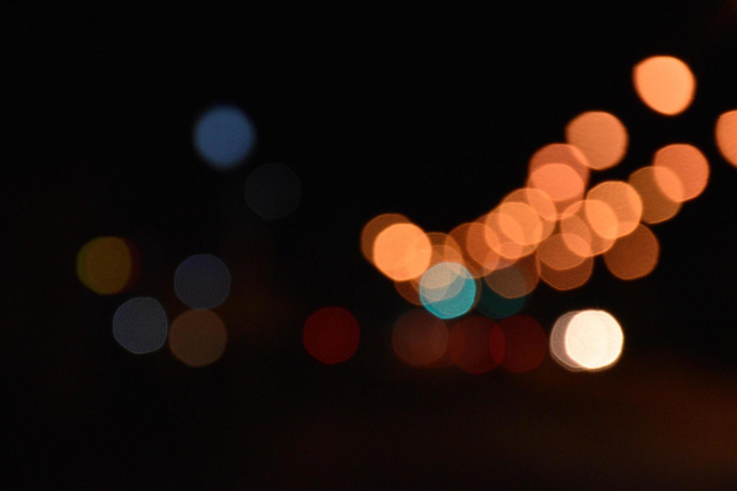 Bokeh street light at night time in urban city of thailand. photo