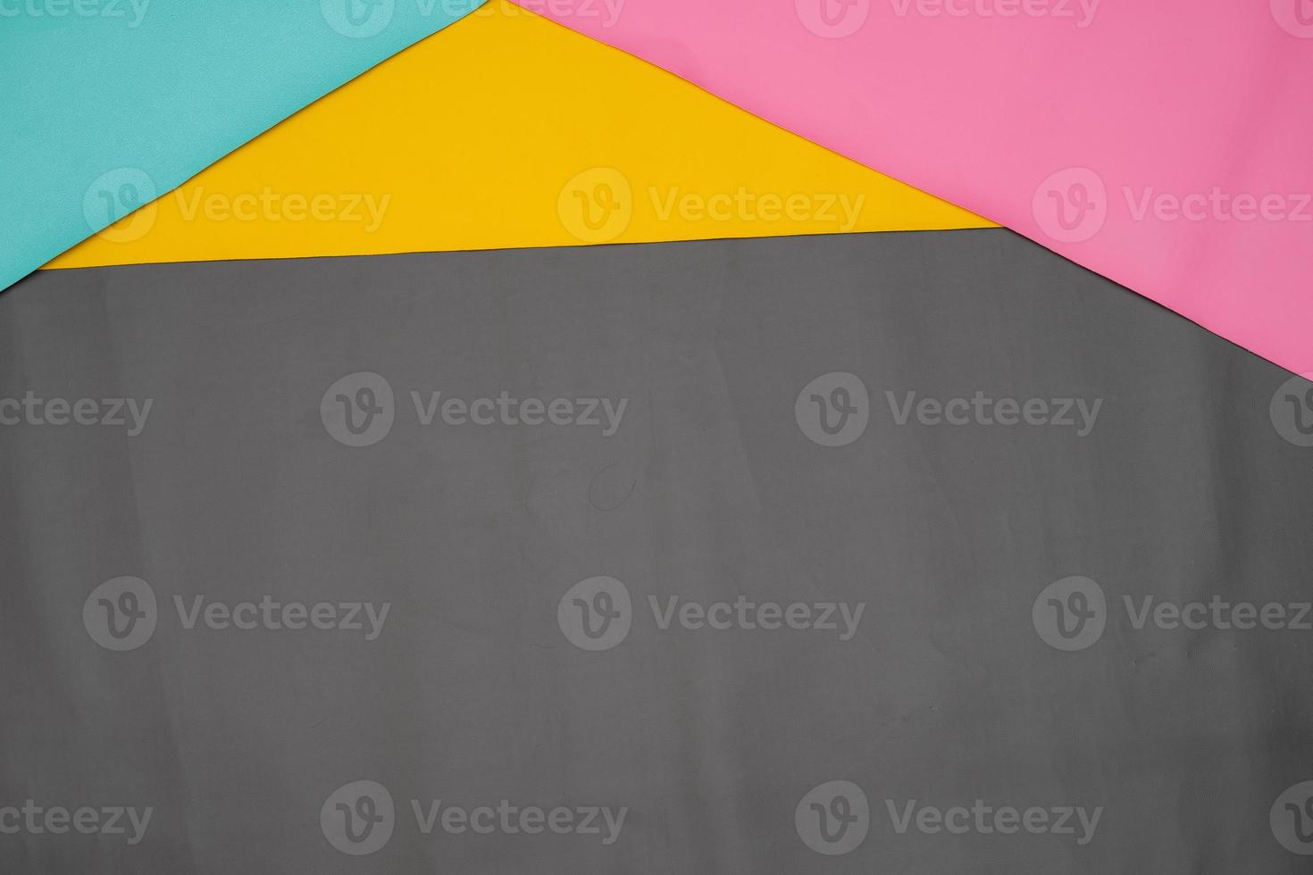 Paper with contrasting colors layered for background. The color tone is divided at the top for the line partition as a copy space. simple and minimalist flat lay composition for wallpaper. photo