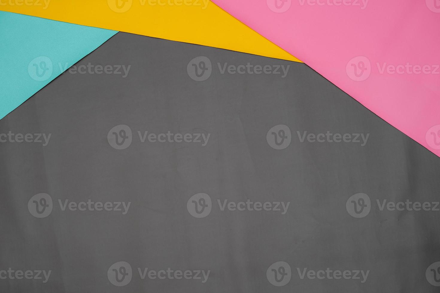 Paper with contrasting colors layered for background. The color tone is divided at the top for the line partition as a copy space. simple and minimalist flat lay composition for wallpaper. photo