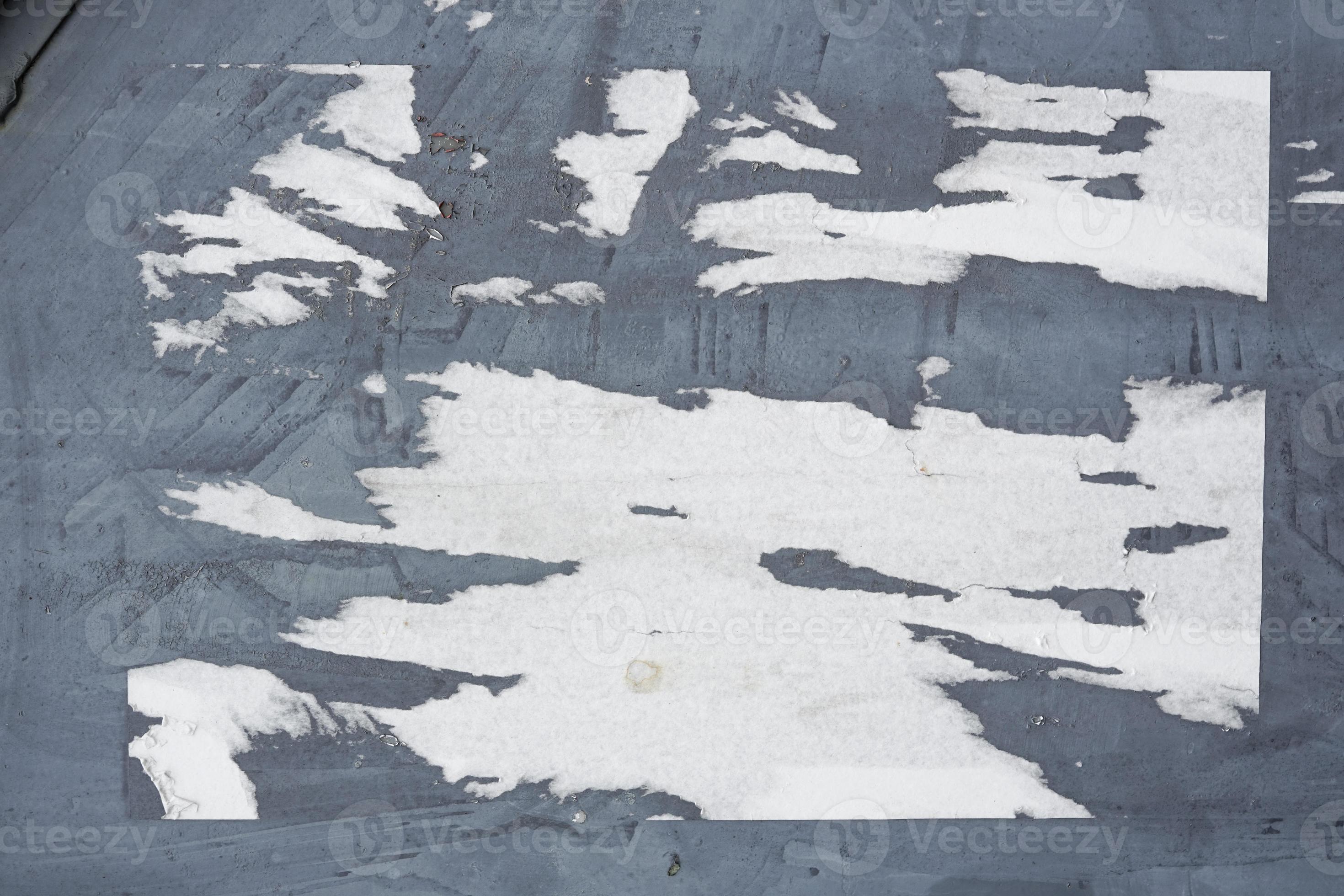 abstract torn paper poster on the wall for background texture. the