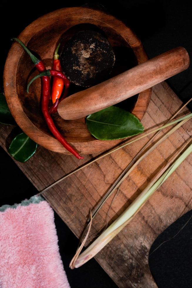 herbs and wooden mortar and pestle. suitable to print on restaurant poster photo