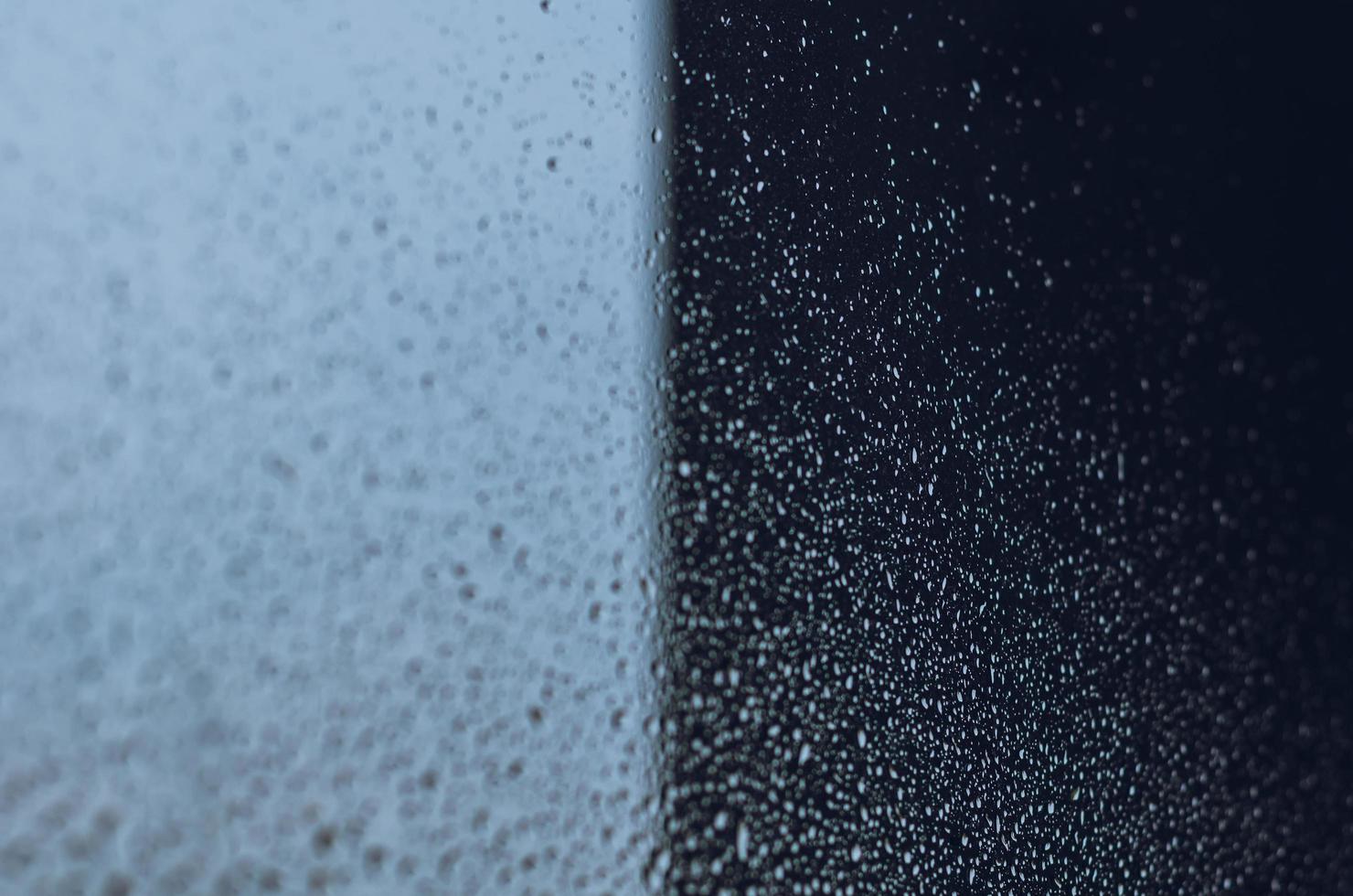 Blurred and focus of rain drop on glass window. photo